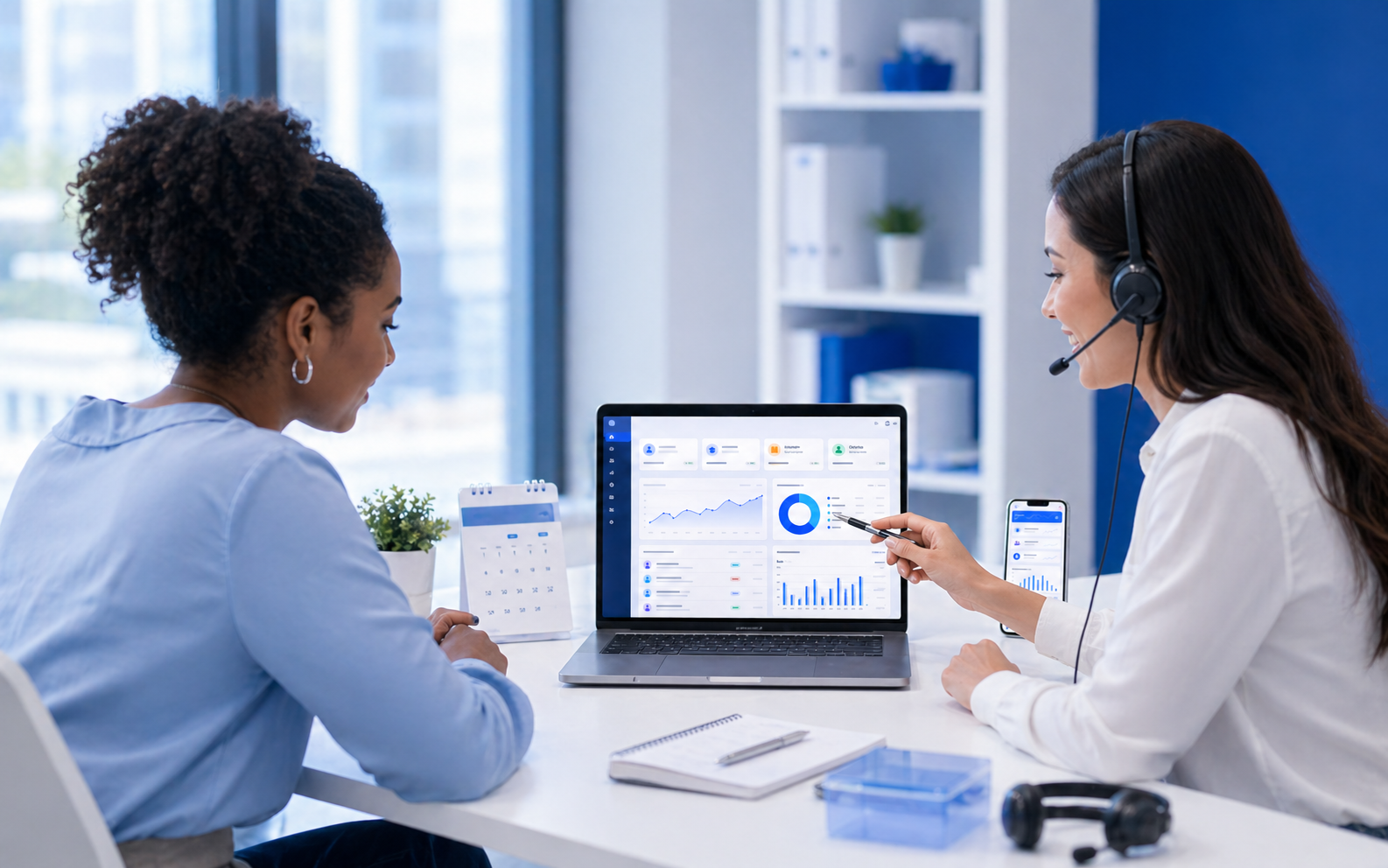 Black client reviewing a dashboard with a support specialist during a consultation